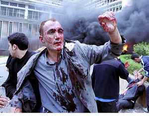 People running from the site of the Algiers suicide bombing <font size=-2>(Source: news.com.au)</font>