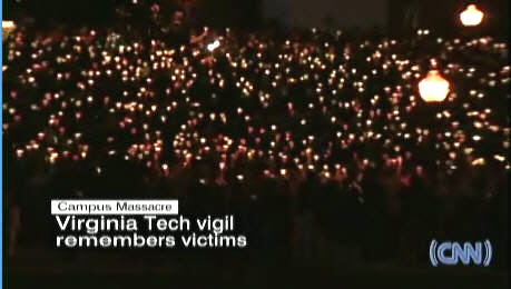 Virginia Tech students hold a candlelight vigil on Tuesday evening. <font size=-2>(Source: CNN)</font>