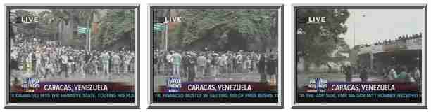 On the left we see students demonstrating early Tuesday evening. The camera pans to the right, where we see riot police on top of the bridge.  Police have been shooting rubber bullets. <font size=-2>(Source: Fox)</font>