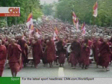 Tens of thousands of Buddhist monks demonstrated in Rangoon, forming a sea of red <font face=Arial size=-2>(Source: CNN)</font>