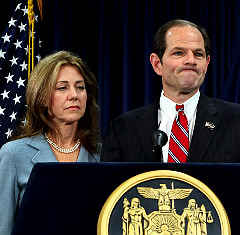 A grim-faced Silda Spitzer stands by her man, Elliott Spitzer, as a prop at Monday's press conference. Spitzer's three daughters were not present.