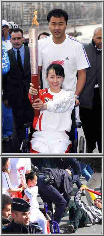 "Torchbearer Jinjing (in wheelchair),a Chinese Para-Olympic athlete, protects the torch to resist protestors' disruptions as she runs along the Seine River in the Beijing Olympic torch relay in Paris, April 7, 2008." <font face=Arial size=-2>(Source: China Daily)</font>