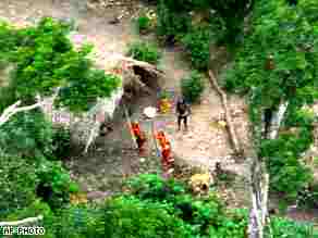 Lost Brazilian tribe preparing for battle with small airplane photographing them <font face=Arial size=-2>(Source: CNN)</font>