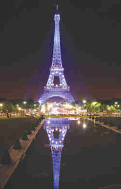 Eiffel Tower with blue and gold stars, symbolizing the EU colors