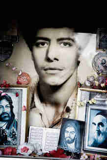 Decorations around the grave of a martyr from the Iran/Iraq war <font face=Arial size=-2>(Source: merip.org)</font>