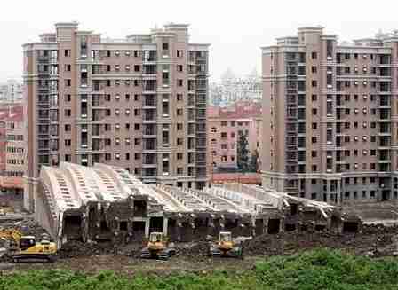 Shanghai building that toppled over, remaining relatively intact <font size=-2>(Source: wsj.com)</font>