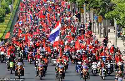 Red-shirted supporters of former Thai PM Thaksin Shinawatra, in mass demonstrations in Bangkok on March 15 <font face=Arial size=-2>(Source: dailymail.co.uk)</font>