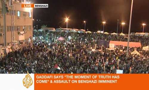 Defiant Benghazi residents shout angry slogans at Gaddafi, as they listen to his speech.