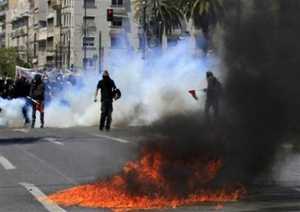 Exploding petrol bombs during clashes with riot police in Athens on Wednesday