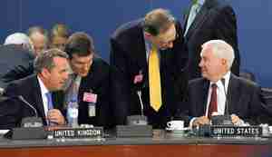 Defense Secretary Robert M. Gates, right, and his British counterpart, Liam Fox, left, at Nato meeting in Brussels, June 8 (Reuters)