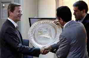 German Foreign Minister Guido Westerwelle (L) shakes hands with rebel council members in Benghazi (Reuters)