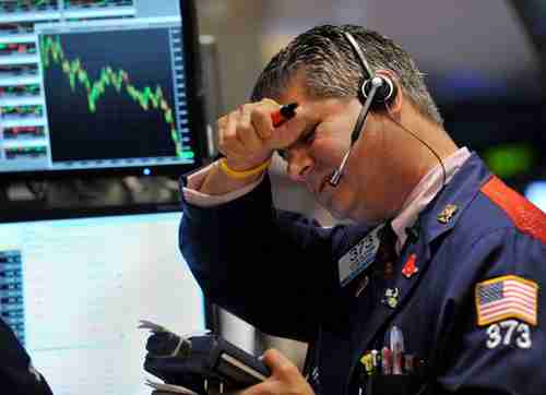 A trader at the NYSE (AFP)