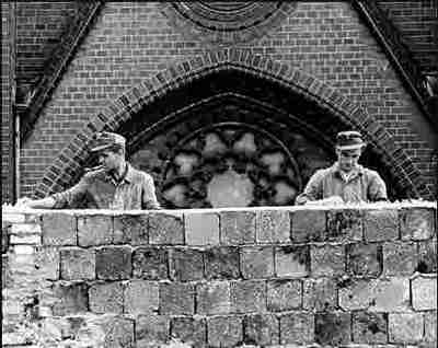 Workers build part of the Berlin Wall 50 years ago, August 13, 1961 (AP)