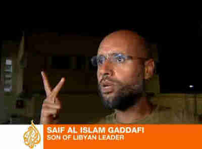 Saif al-Islam Gaddafi shows up for reporters (Al-Jazeera)