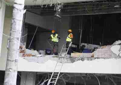 Rescue workers search for survivors in U.N. building in Abuja, Nigeria (Reuters)