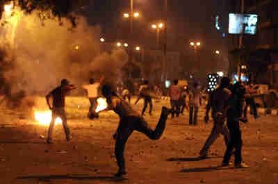  Demonstrators outside the Israeli embassy building in Cairo early on Saturday (AFP)