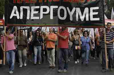 Doctors and medics march during a protest in central Athens on Friday (Reuters)