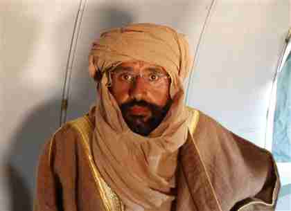  Saif al-Islam Gaddafi is seen sitting in a plane in Zintan on Saturday (Reuters)