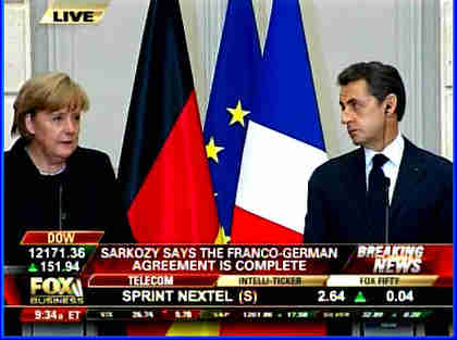 Somber, anxious Merkel and Sarkozy at a press conference on Monday