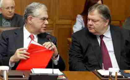 Prime Minister Lucas Papademos (left) speaks to Finance Minister Evangelos Venizelos in Parliament on Friday. (Kathimerini)