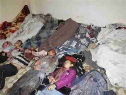 Bodies of people whom al-Assad's army massacred in Homs (Reuters)