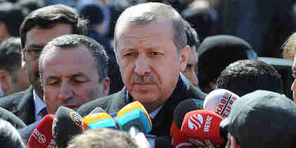 Erdogan at press conference after leaving a mosque on Friday (Zaman)