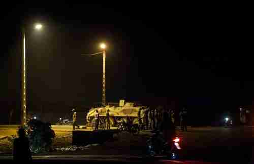 Soldiers man a roadblock along the road leading from military headquarters to the capital, Bamako, Mali on Tuesday