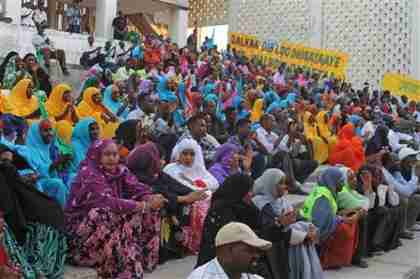 From March 19: Somalis in festive colors attend a concert in the newly opened Somali National Theatre.  A suicide bomber attack took place on April 4. (AP)