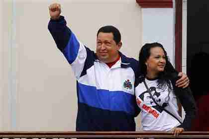 Hugo Chvez with his daughter, Virginia, waving from the People's Balcony at Miraflores Palace in Caracas on Friday (Reuters)