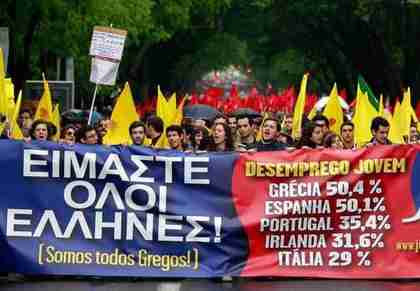 Young protesters in Lisbon carry a banner saying 'We are all Greek,' listing some youth unemployment rates.  (AP)