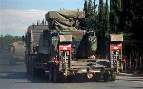 A Turkish military truck transports a mobile missile launcher to the Syrian border (AP)