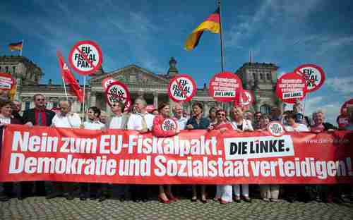 Members of Germany's Left Party protest the treaty on Friday.  The sign reads: 'No to the EU fiscal pact. Defend democracy and the welfare state.' (DAPD)