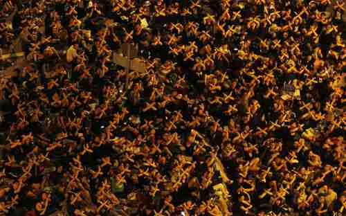 Hong Kong - Tens of thousands of protesters cross their arms, symbolically saying 'Stop' to the government. (AP)