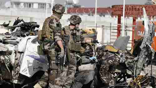 French soldiers arrive at the scene of Tuesday suicide bombing in Kabul (AP)