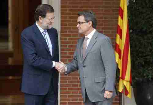 Spain's Prime Minister Mariano Rajoy (L) shakes hands with Catalonia's President Artur Mas, prior to their meeting on Thursday.  Reports indicate that the meeting didn't go well.  (Reuters)