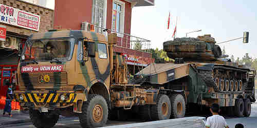 Turkey deploys armored vehicles to Syrian border on Friday, after Syrian mortars land in Turkey (AA)