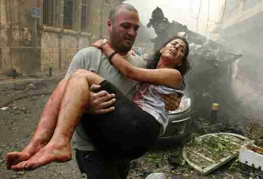 A woman is rescued from the Beirut bombing on Friday (Reuters)