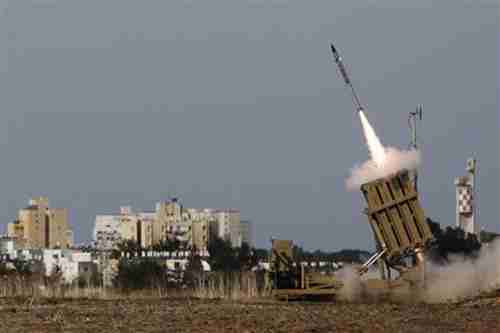 Israel launches a rocket from its 'Iron Dome' defensive system to intercept an incoming missile launched form Gaza.  (Reuters)