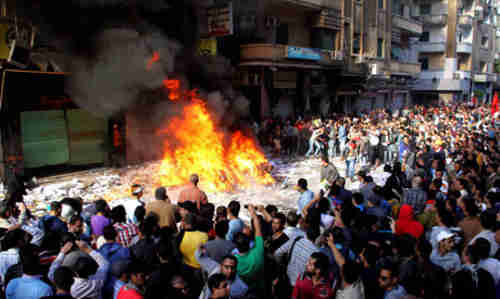 Protesters burn ransacked contents of Muslim Brotherhood offices in Alexandria