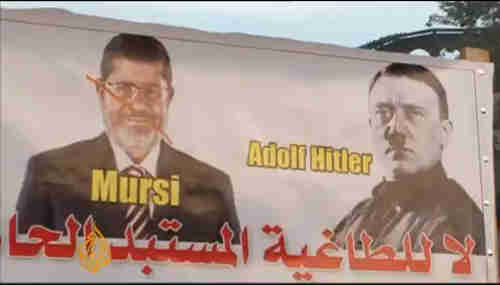 Anti-Morsi banner in Tahrir Square on Friday (al-Jazeera)