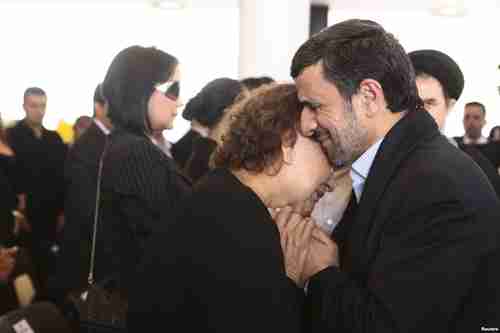 Ahmadinejad hugs Chvez's mother, Elena Frias, during funeral services on Friday (Reuters)