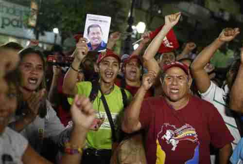 Maduro supporters shout slogans during a Tuesday protest in Caracas (Reuters)