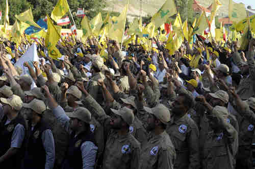 Hezbollah army saluting (EPA)