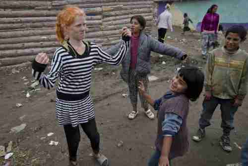 Sasha Ruseva, left, the Bulgarian mother of ten children, dancing on Friday (AP) [Correction: This is one of Sasha's daughters.]