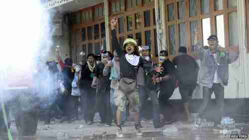 Violent anti-government riots outside Government House in Bangkok on Sunday (Reuters)