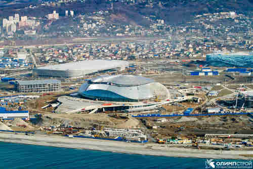 Sochi by the beach, with snowy mountains in the distance