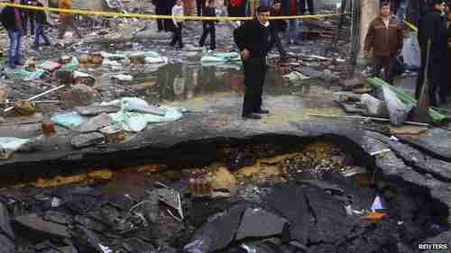 Huge crater in front of Cairo police station from Friday's terrorist bombing (Reuters)