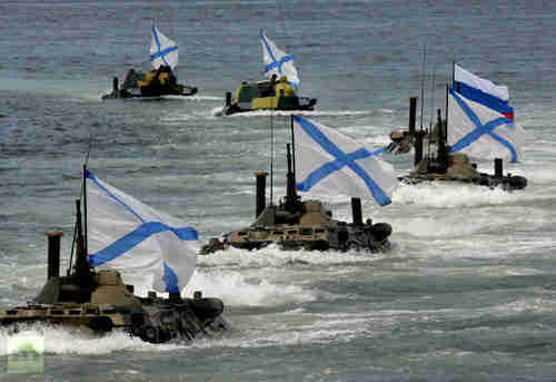 Armored personnel carries of Marine Corps of Russian Pacific Fleet are heading to shore after landing from an amphibious assault ship. (RT)