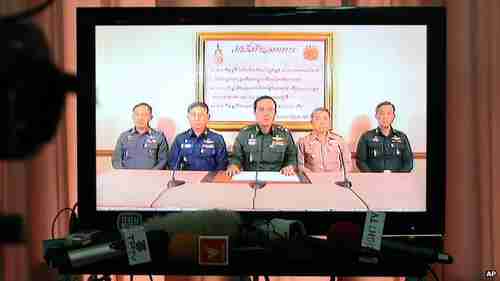 General Prayuth Chan-ocha (center) announces his army coup on nationwide television on Thursday