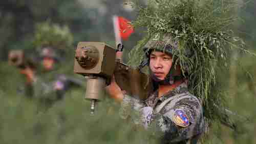 Chinese soldier in live-fire air defense exercise in 2010 (AP)